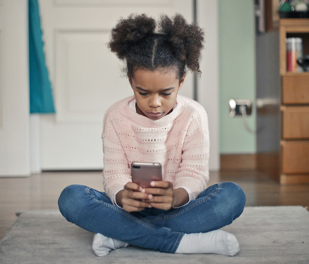 child playing with smartphone